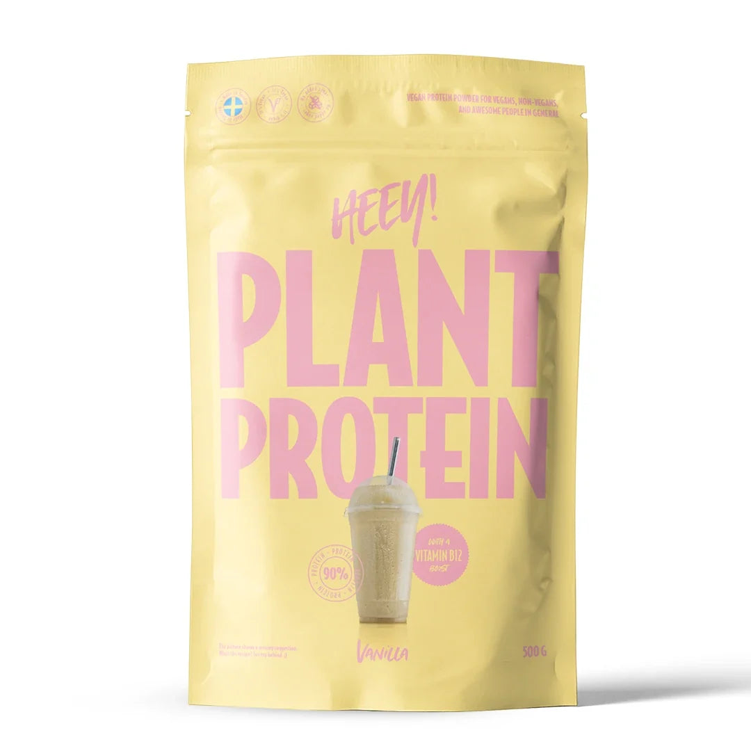 Heey! Veganskt Protein 500 g proteinpulver i en ljusgul påse med rosa text för smaken vanilj., bild 3 av 9