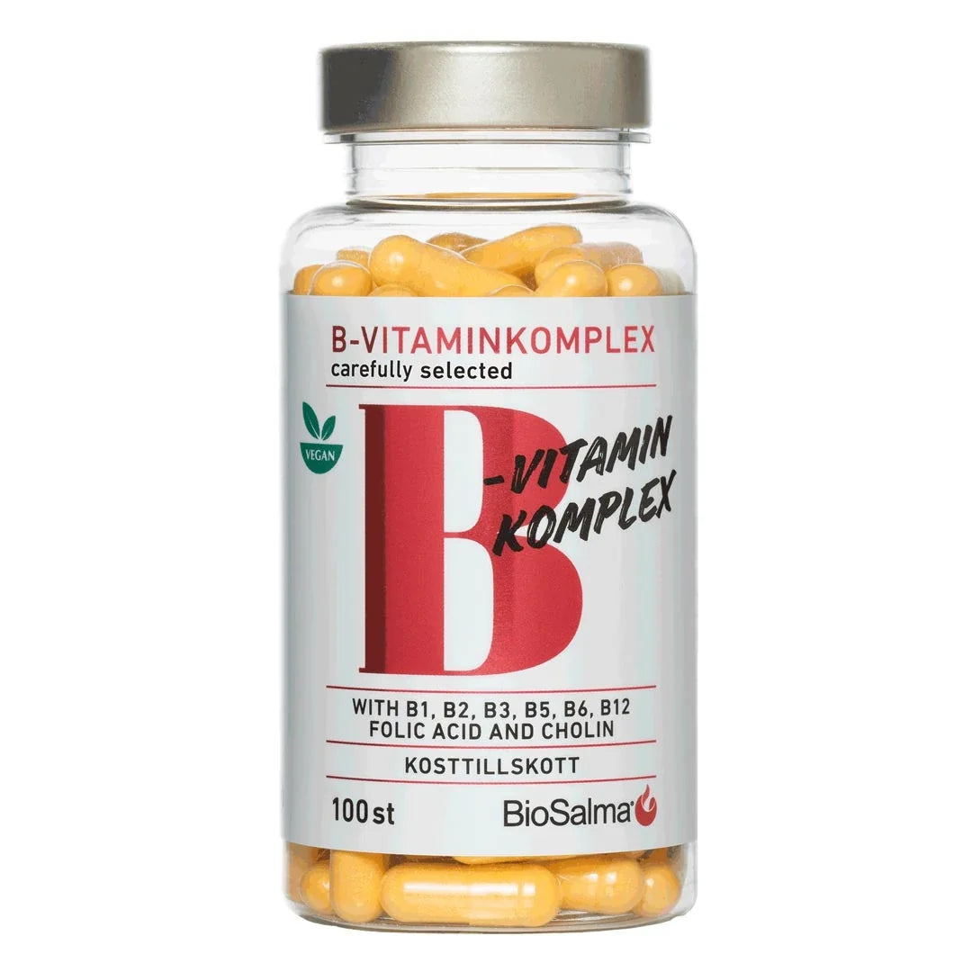 BioSalma B-vitamin Komplex 100 caps i en genomskinlig burk med silverlock, vit etikett och gula kapslar.