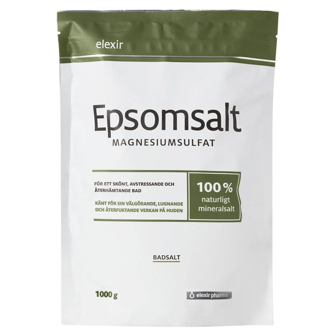 Elexir Pharma Epsomsalt 1kg i en vit påse med olivgröna detaljer, ett naturligt mineralsalt för avkopplande bad.
