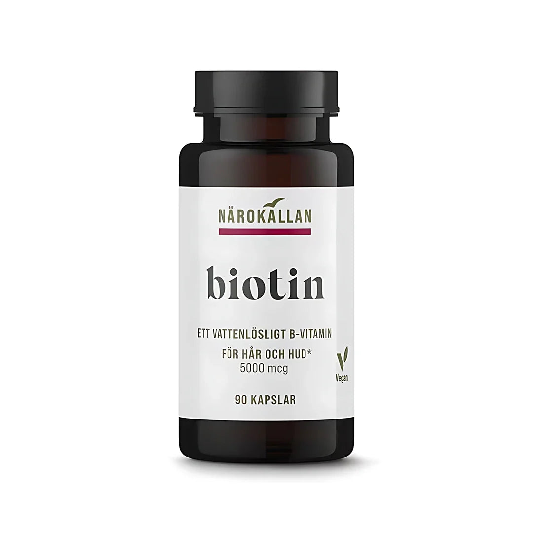Närokällan Biotin 5000 mcg 90 caps, ett veganskt kosttillskott i en mörkbrun burk med vit etikett.