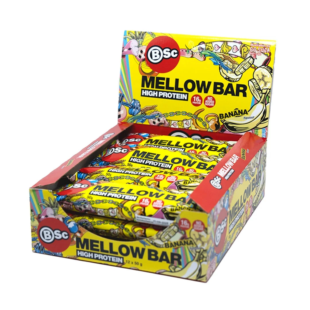 12 x BSc Mellow Proteinbar 50 g Mixlåda i en öppen, gul displaykartong med färgglada motiv för banansmak.