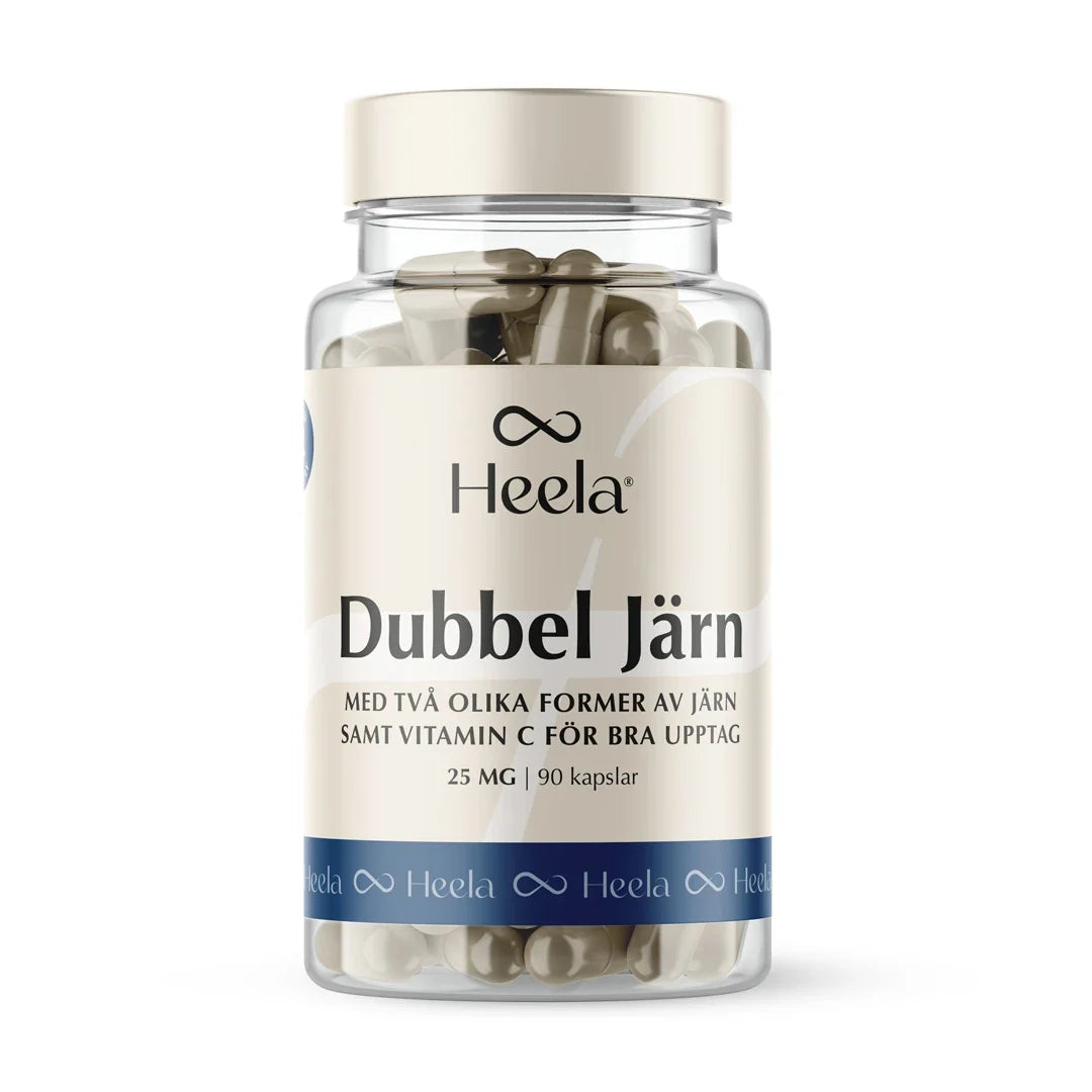 Heela Dubbel Järn 25 mg 90 caps kosttillskott i en genomskinlig plastburk med beige och blå etikett, fylld med kapslar., bild 1 av 1