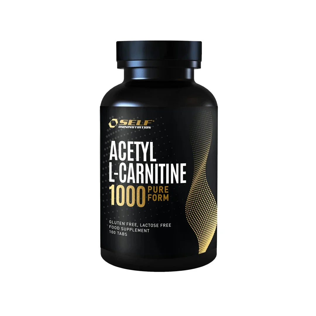 Self Omninutrition Acetyl L-Carnitine 1000 100 tabs kosttillskott i en svart burk med guldiga och vita detaljer.