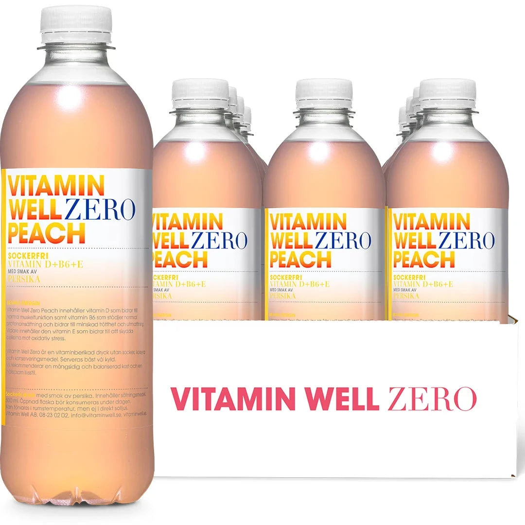12 x Vitamin Well Zero 500 ml Peach i ett vitt flak med transparenta flaskor fyllda med ljusrosa dryck., bild 1 av 1