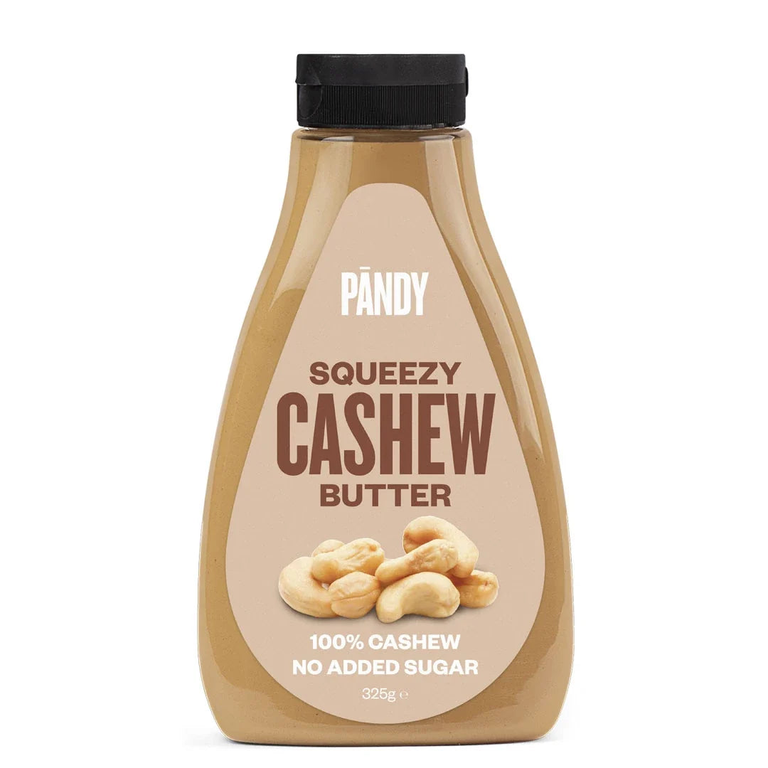 Pändy Squeezy 325 g i smaken Cashew Butter i en genomskinlig squeeze-flaska med beige etikett.