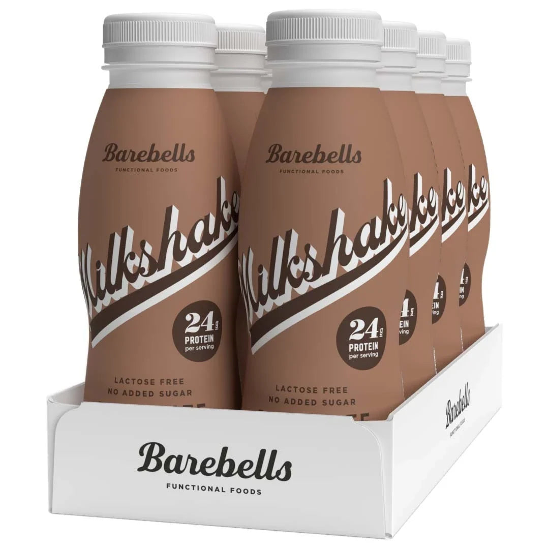 8 x Barebells Milkshake 330 ml Chocolate i ett vitt flak med åtta bruna flaskor fyllda med laktosfri proteinmilkshake., bild 1 av 1