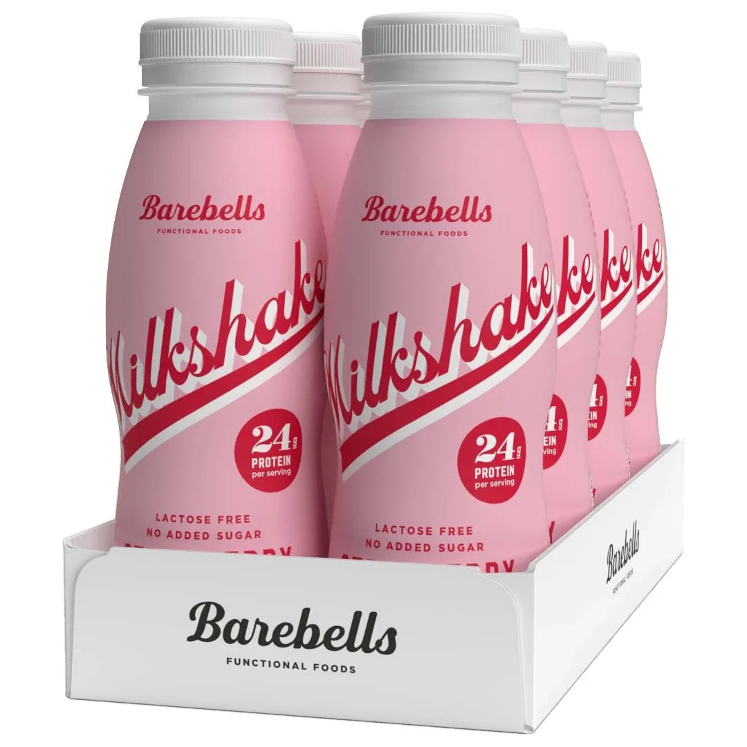 8 x Barebells Milkshake 330 ml Strawberry i en vit kartong med rosa flaskor och röda detaljer.