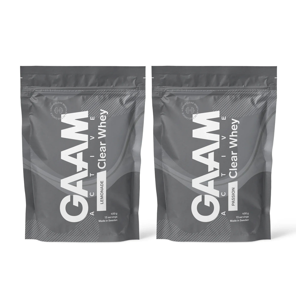 2 x GAAM Active Clear Whey Proteinpulver 400 g i två mörkgråa påsar för smakerna Lemonade och Passion.