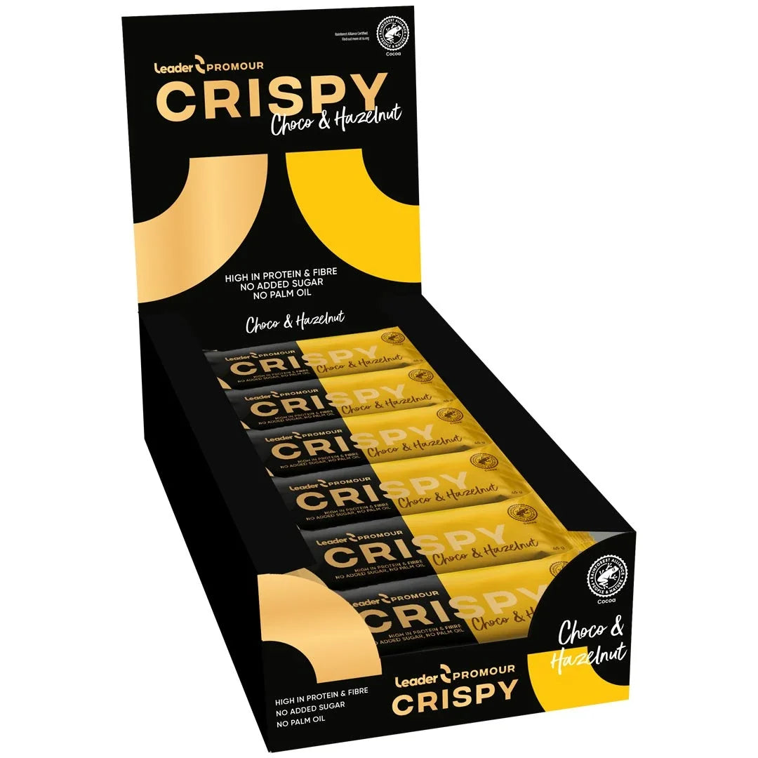 18 x Leader Promour Crispy 45 g Chocolate & Hazelnut i en svart och gul displaylåda med matchande proteinbars.